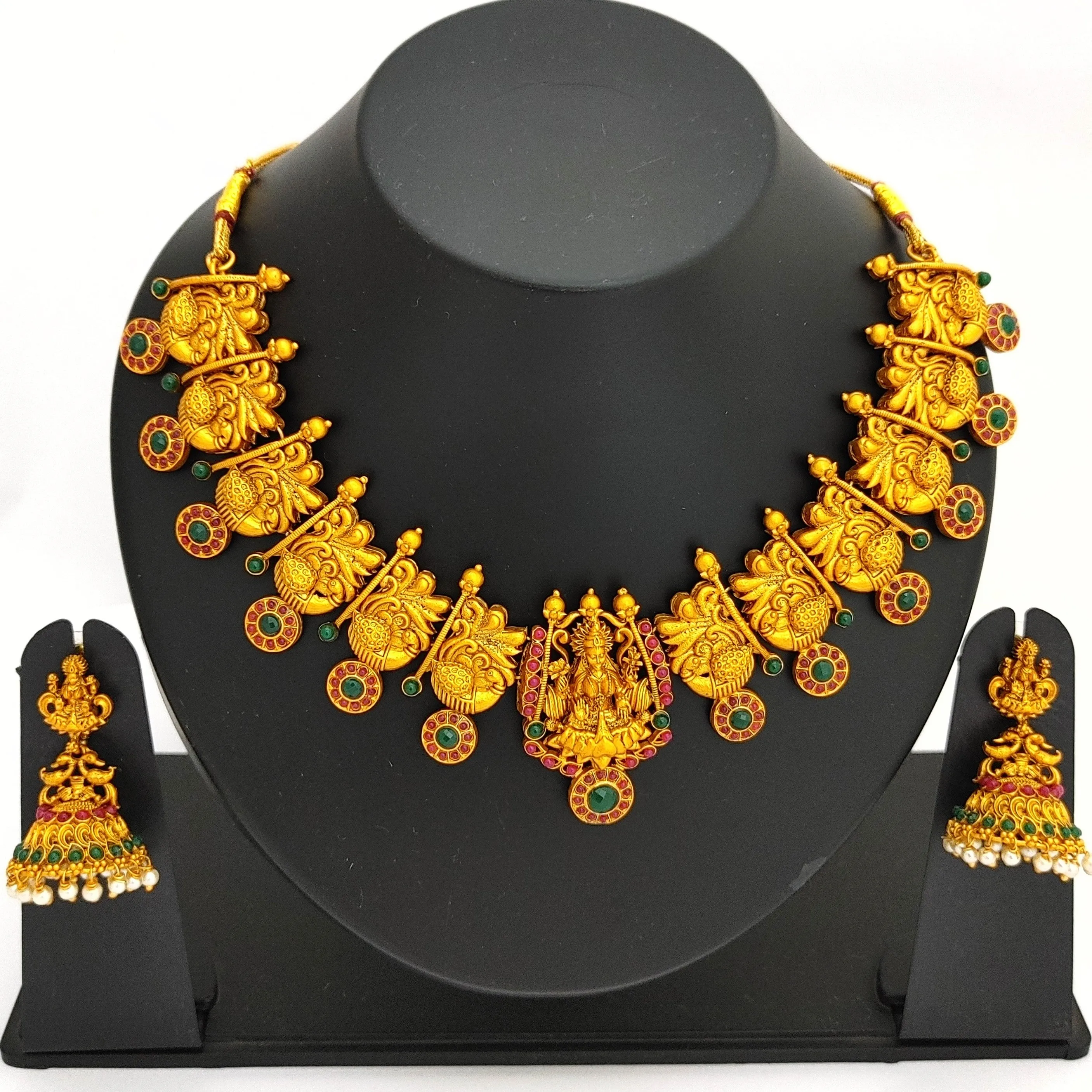 Estele Gold Plated Divinely Crafted Lakshmi Ji Matt Finish Temple Necklace Set with Colored Stones and Pearls for Women